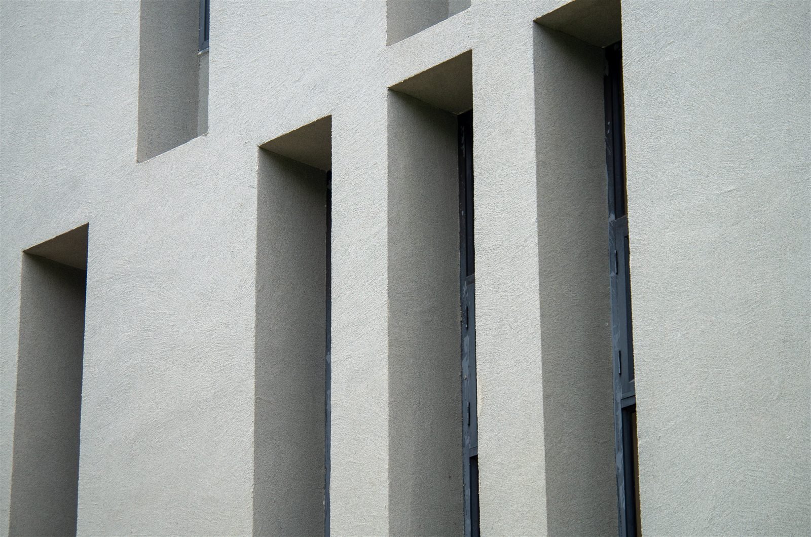 Natural stone texture around deep window reveals