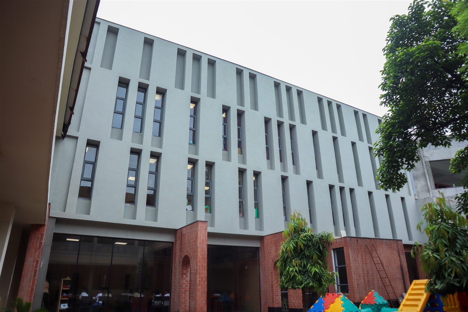 Completed institutional facade finished with Luxstone natural stone texture